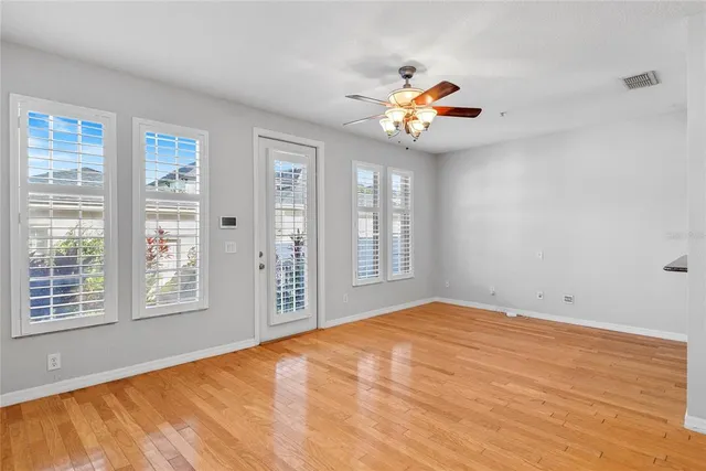 a view of an empty room with a window