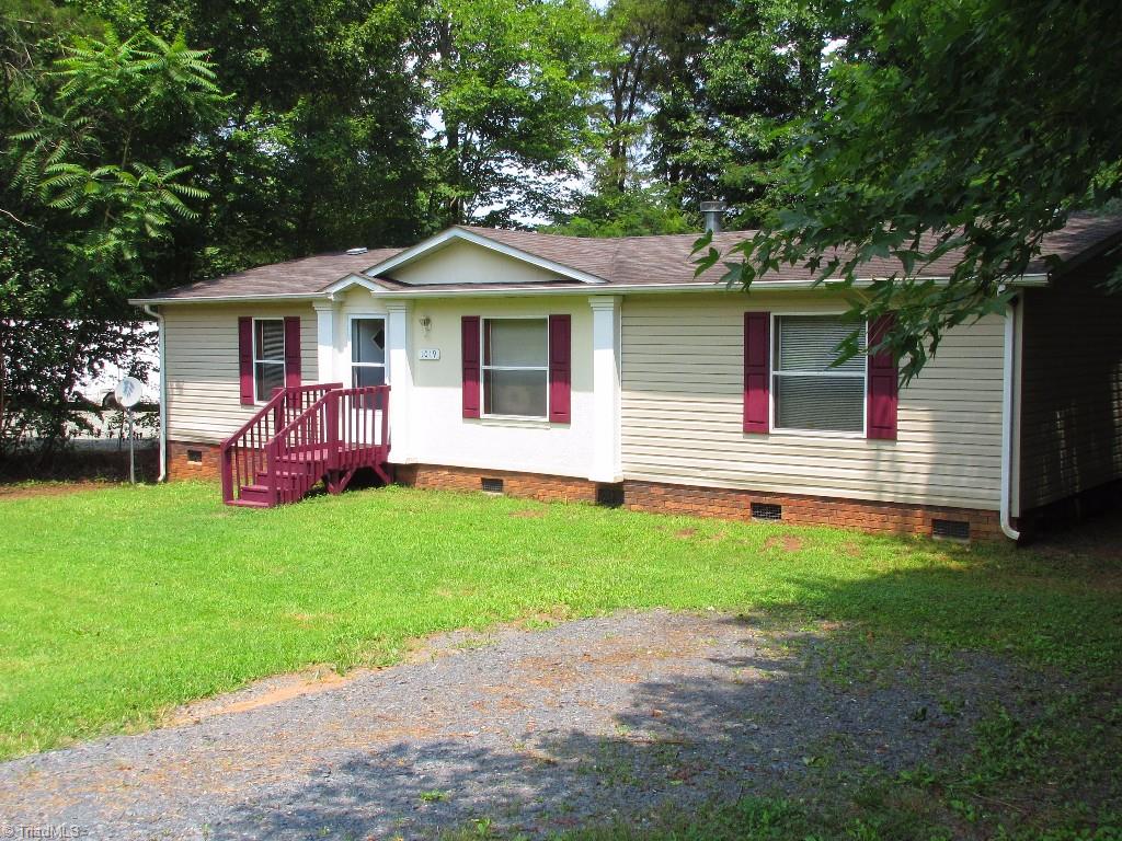 1019 Chisholm Road Ramseur, NC 27316 - Photo 1 of 13 Great front yard for potential garden! Driveway for at least two.
