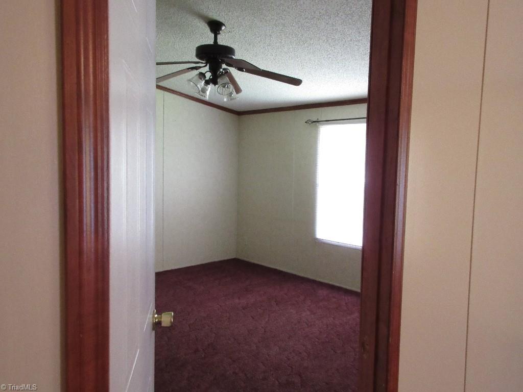 1019 Chisholm Road Ramseur, NC 27316 - Photo 9 of 13 Second Bedroom has a closet too.