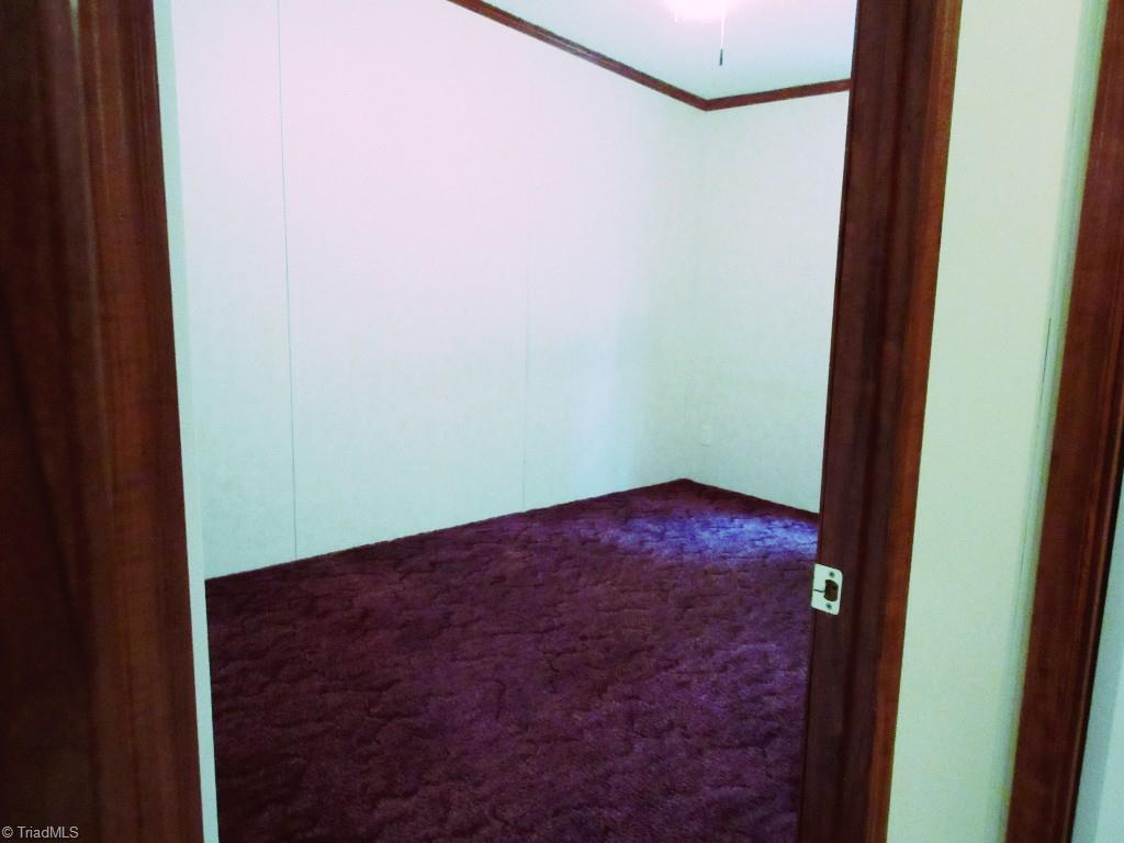 1019 Chisholm Road Ramseur, NC 27316 - Photo 10 of 13 Third bedroom, has window and nice closet.