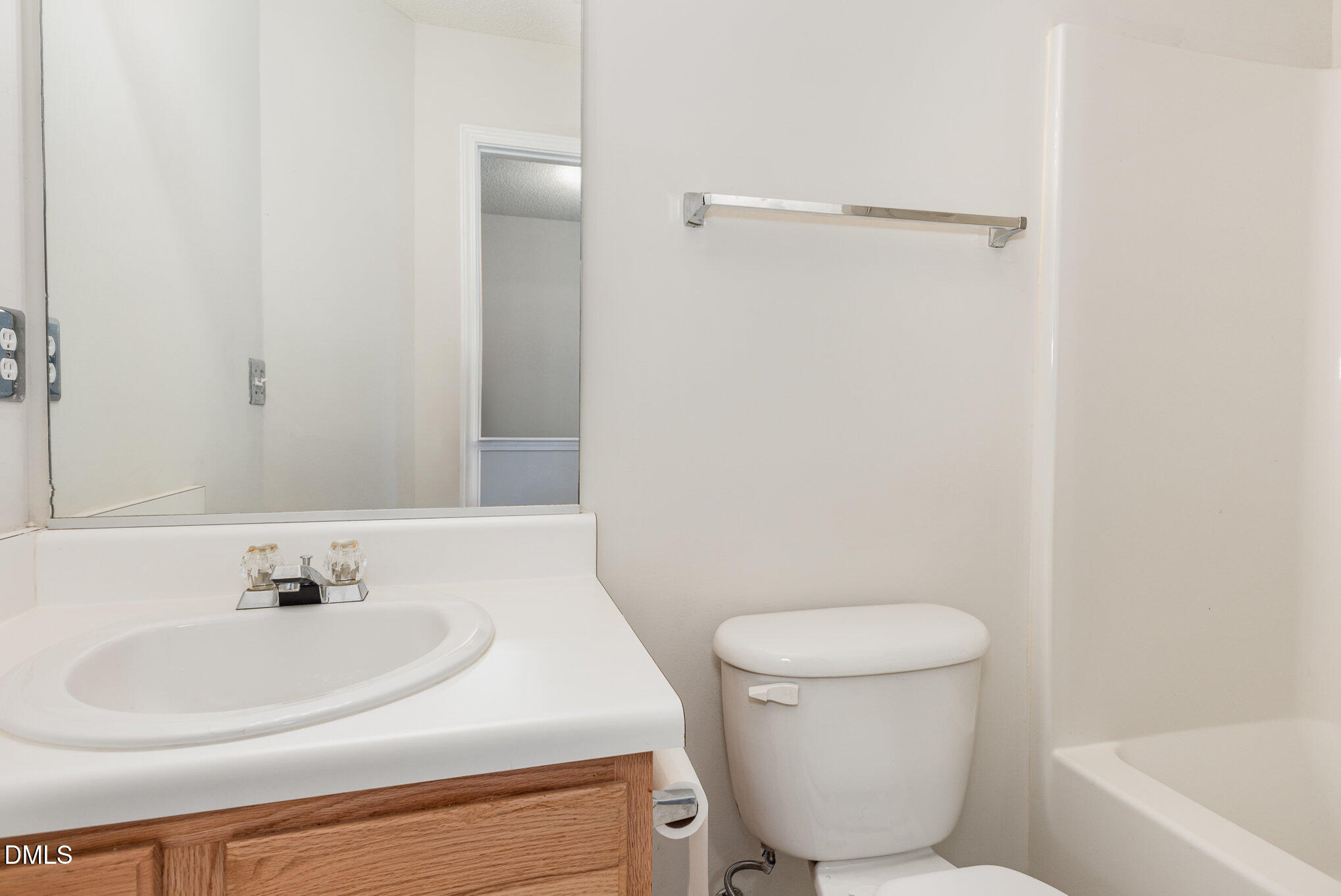 10947 Pendragon Place Raleigh, NC 27614 - Photo 18 of 21 a bathroom with a sink a toilet and shower