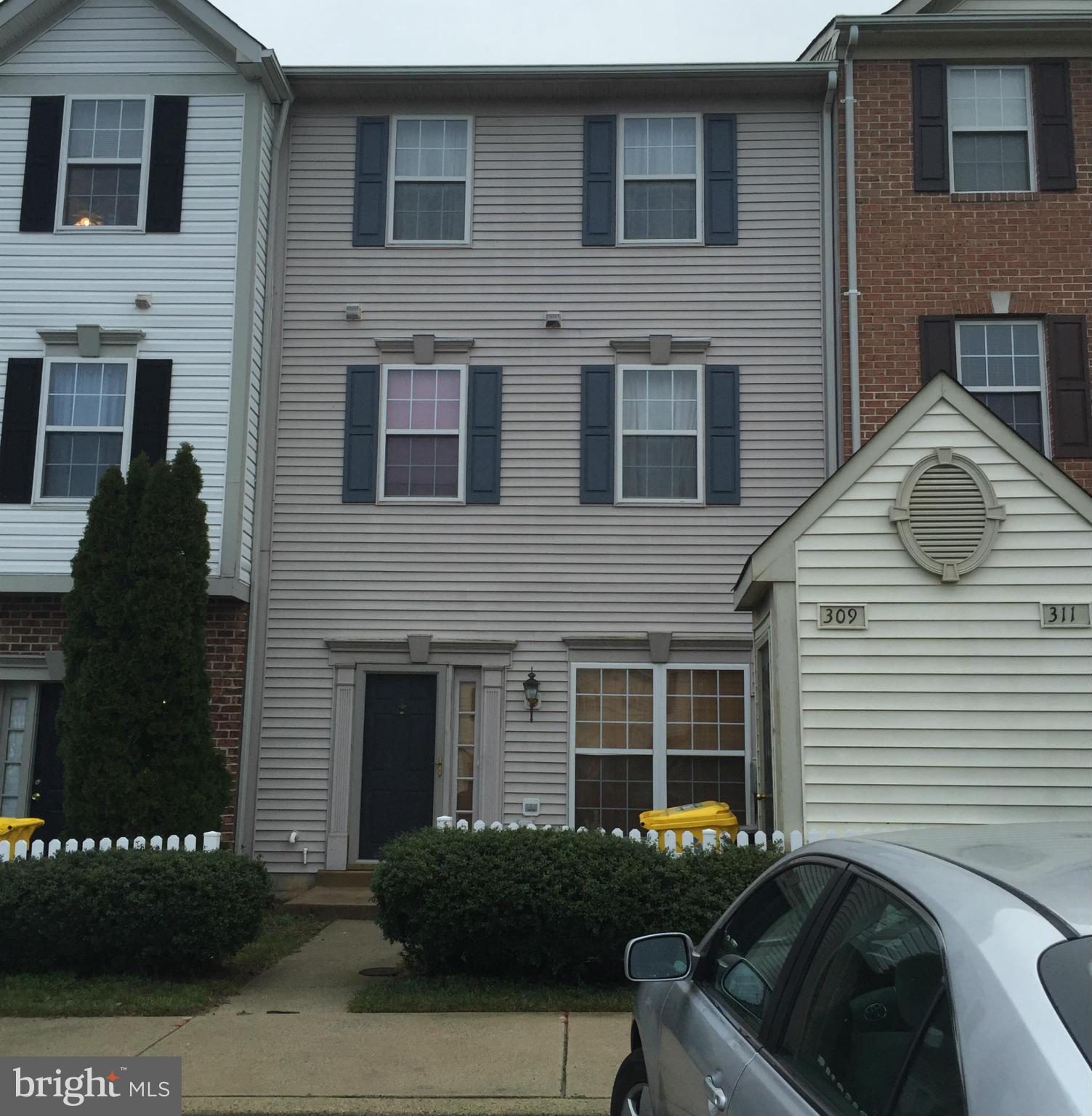 309 Assembly Point Court Odenton, MD 21113 - Photo 1 of 25 a front view of a house with a yard