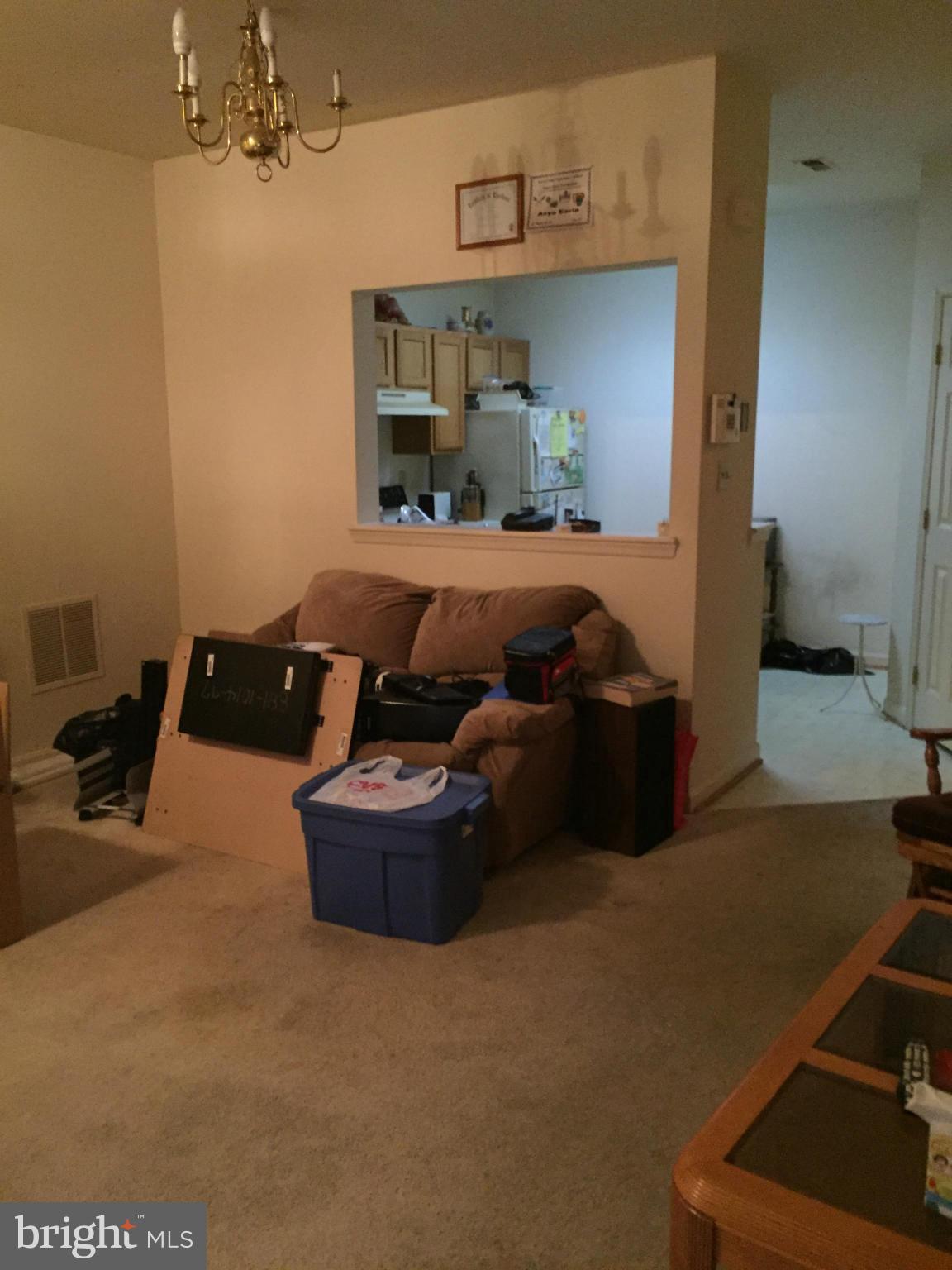 309 Assembly Point Court Odenton, MD 21113 - Photo 11 of 25 a room with furniture and a chandelier