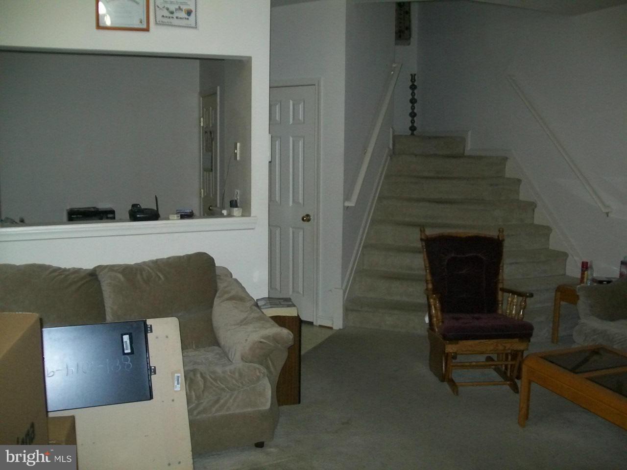 309 Assembly Point Court Odenton, MD 21113 - Photo 13 of 25 a living room with furniture and a fireplace