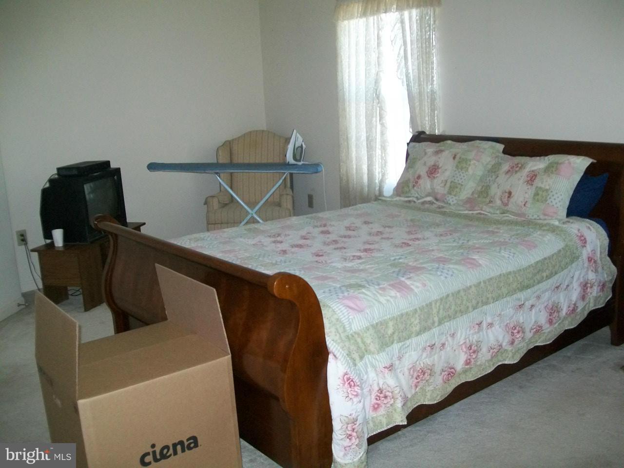 309 Assembly Point Court Odenton, MD 21113 - Photo 18 of 25 a bedroom with bed and window