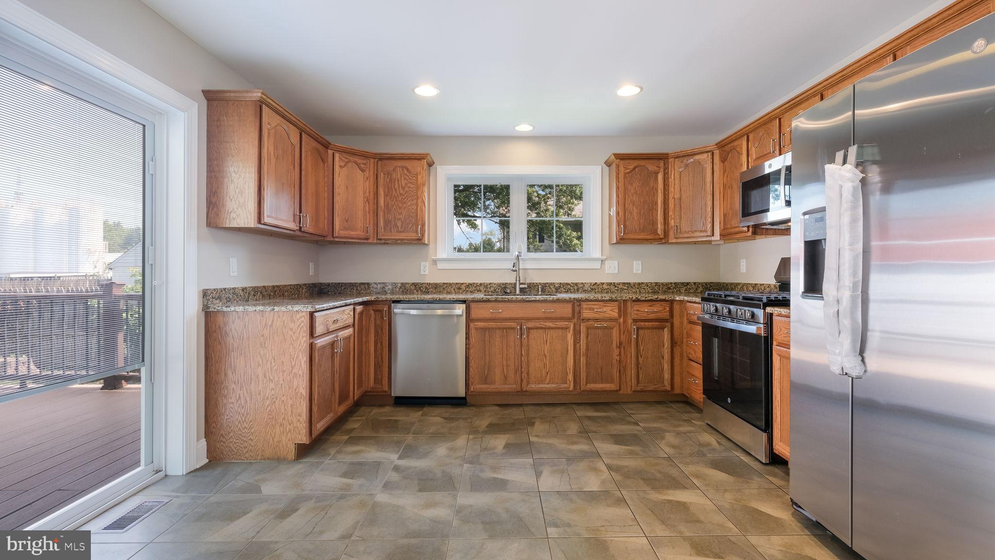 5087 Stump Road Pipersville, PA 18947 - Photo 7 of 35 Large undermount sink, granite counters, CT floor.