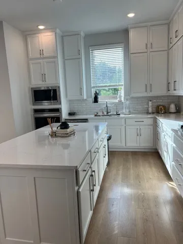 a bedroom with a bed and chair