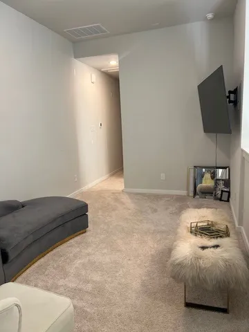 a living room with furniture and a couch