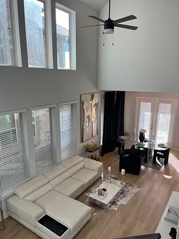 a living room with furniture and wooden floor