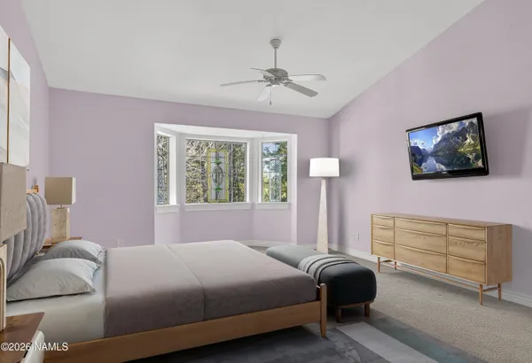 a bathroom with a granite countertop toilet sink and mirror