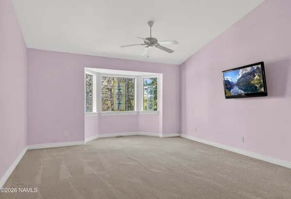 a very nice looking room with wooden floor