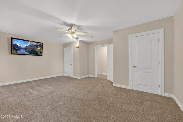 a view of an empty room with a fireplace
