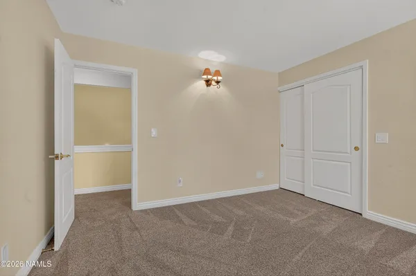 a view of a chair and tables in the balcony