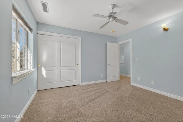 a front view of a building with sitting area