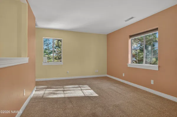a view of balcony with wooden floor