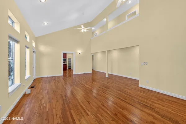 a large kitchen with kitchen island granite countertop a large counter top stainless steel appliances and cabinets