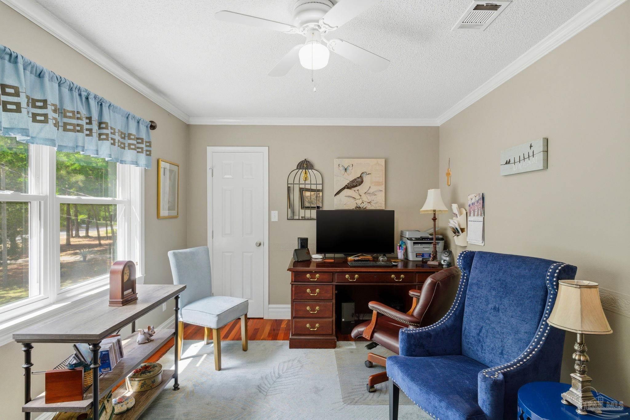 6930 Summit Way Milton, FL 32570 - Photo 34 of 71 a view of a workspace with furniture and a window