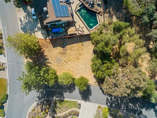 an aerial view of a house having swimming pool
