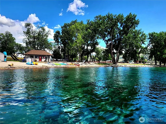 a swimming pool view with a lake view