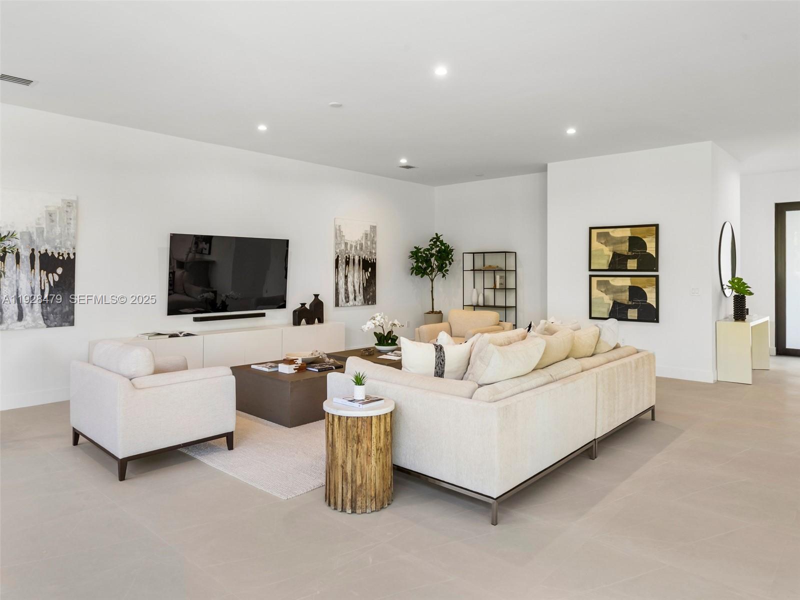 7285 Southwest 72nd Street Miami, FL 33143 - Photo 13 of 53 a living room with furniture and a flat screen tv