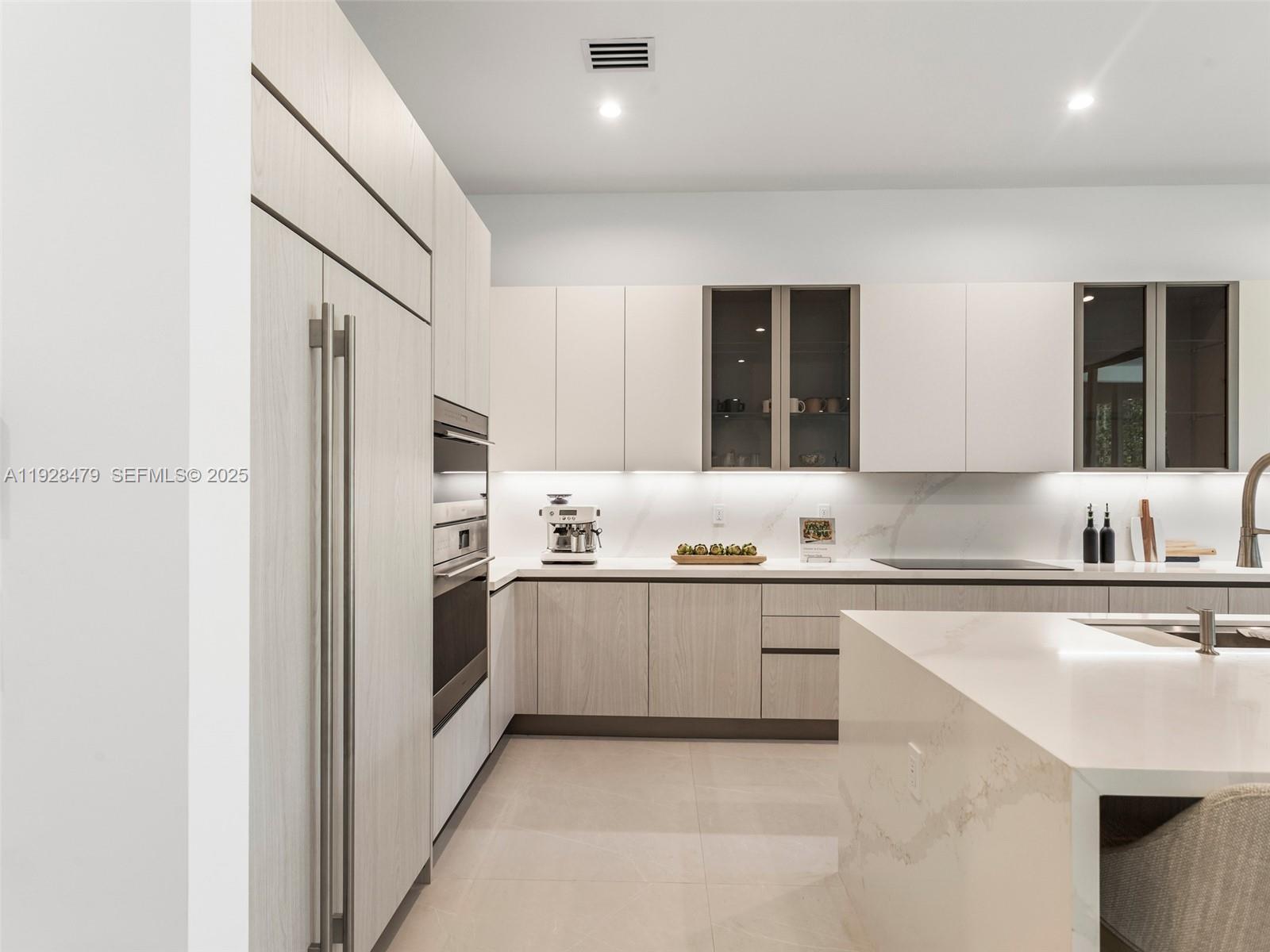 7285 Southwest 72nd Street Miami, FL 33143 - Photo 16 of 53 a large kitchen with stainless steel appliances granite countertop a refrigerator and a sink