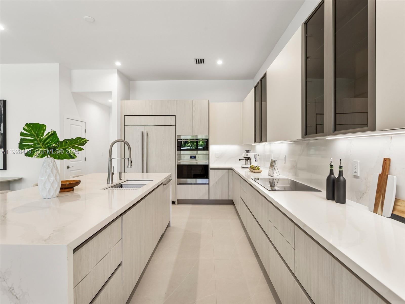 7285 Southwest 72nd Street Miami, FL 33143 - Photo 17 of 53 a large kitchen with a sink and cabinets