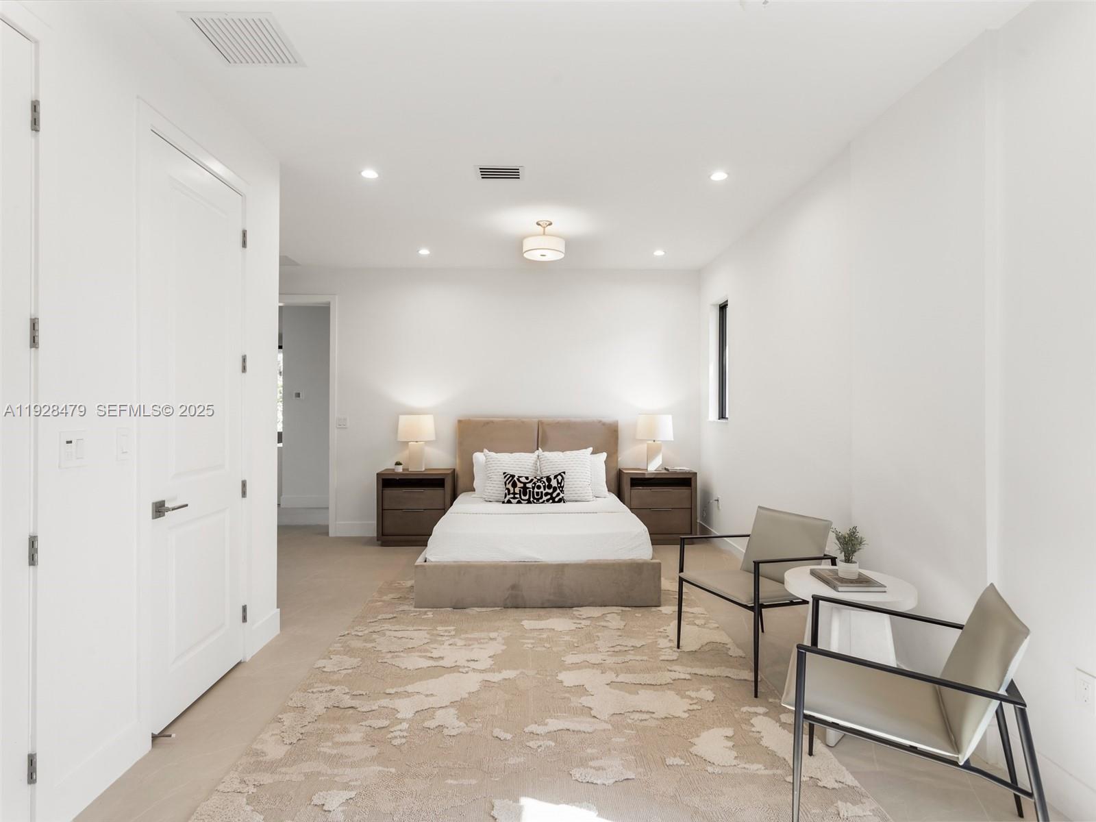 7285 Southwest 72nd Street Miami, FL 33143 - Photo 25 of 53 a spacious bedroom with a bed and a table