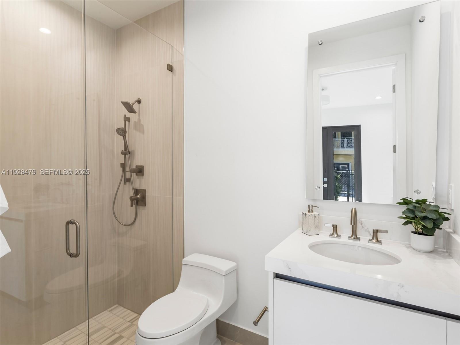 7285 Southwest 72nd Street Miami, FL 33143 - Photo 26 of 53 a bathroom with a sink toilet and shower