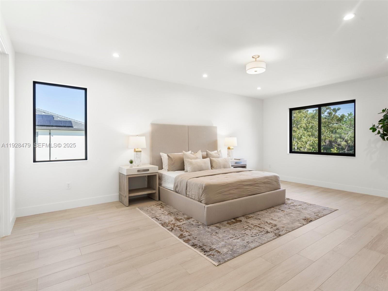 7285 Southwest 72nd Street Miami, FL 33143 - Photo 27 of 53 a room with a bed and a painting on the wall