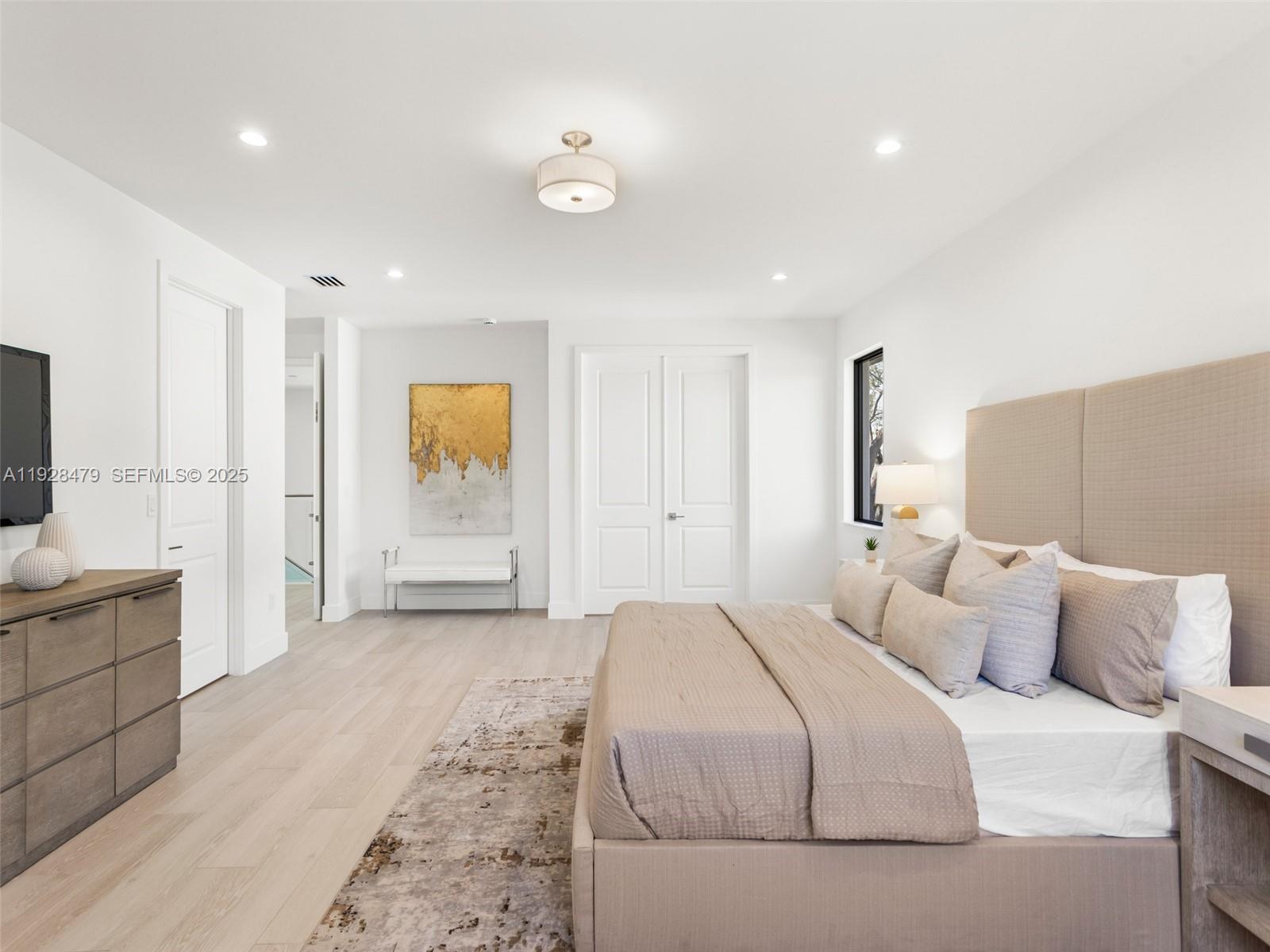 7285 Southwest 72nd Street Miami, FL 33143 - Photo 29 of 53 a spacious bedroom with a large bed and a bathroom