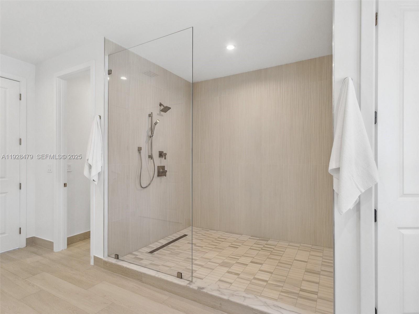 7285 Southwest 72nd Street Miami, FL 33143 - Photo 34 of 53 a bathroom with a shower and a glass door