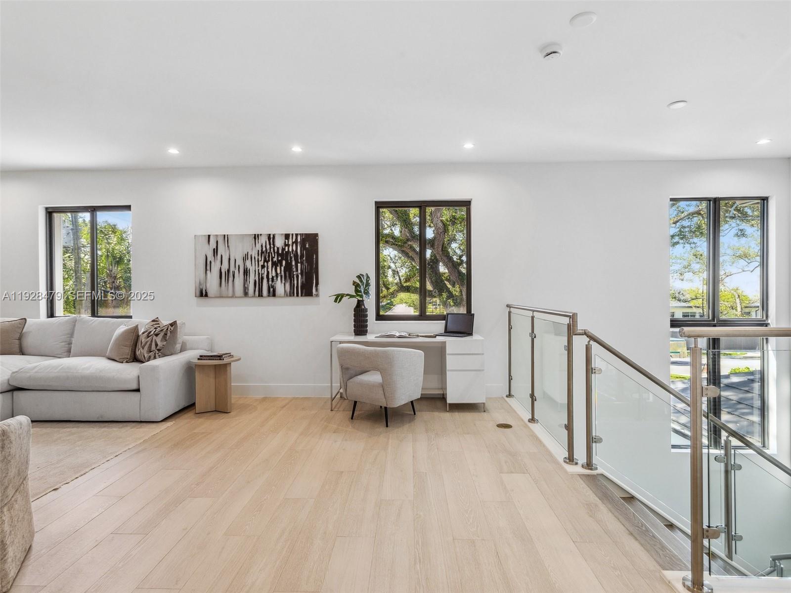 7285 Southwest 72nd Street Miami, FL 33143 - Photo 41 of 53 a living room with furniture and a wooden floor