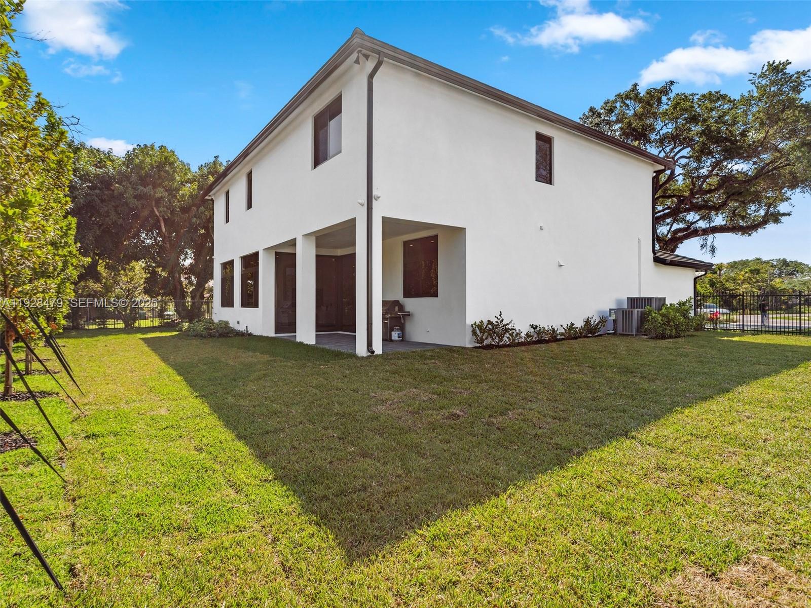 7285 Southwest 72nd Street Miami, FL 33143 - Photo 46 of 53 a view of a house with a yard