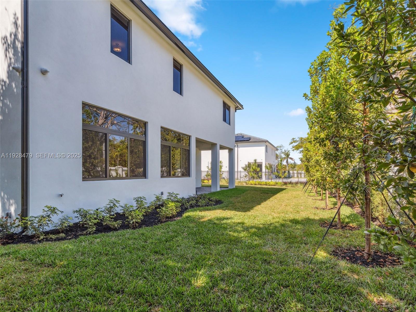 7285 Southwest 72nd Street Miami, FL 33143 - Photo 47 of 53 a view of a house with a yard