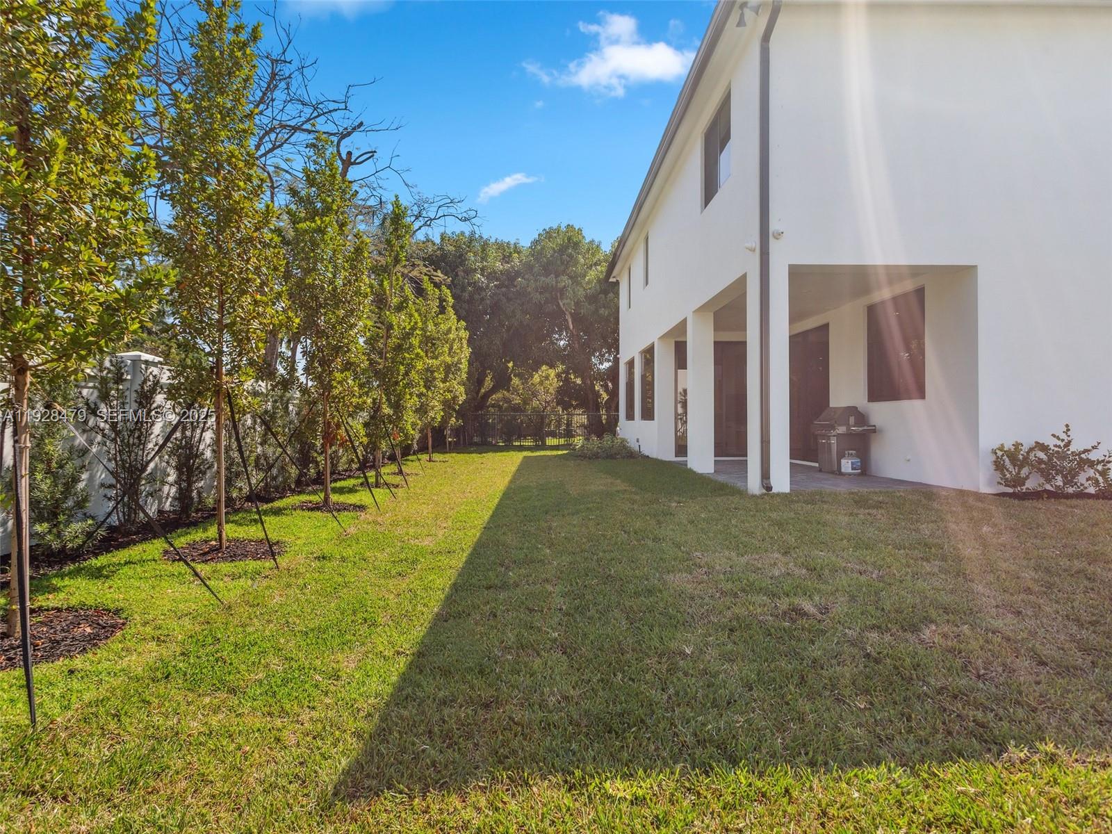 7285 Southwest 72nd Street Miami, FL 33143 - Photo 49 of 53 a view of a house with a yard
