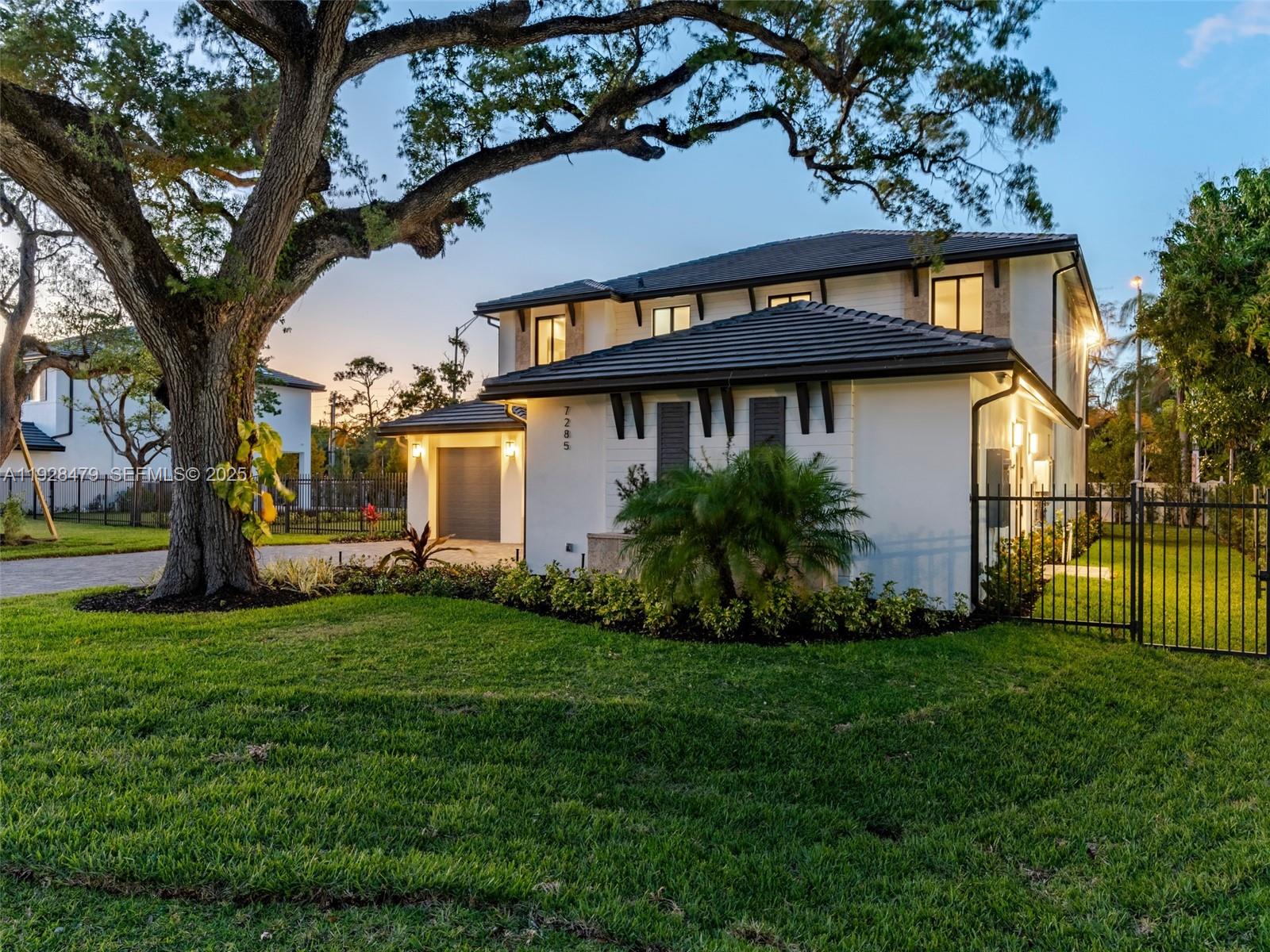 7285 Southwest 72nd Street Miami, FL 33143 - Photo 5 of 53 a view of a house with a yard