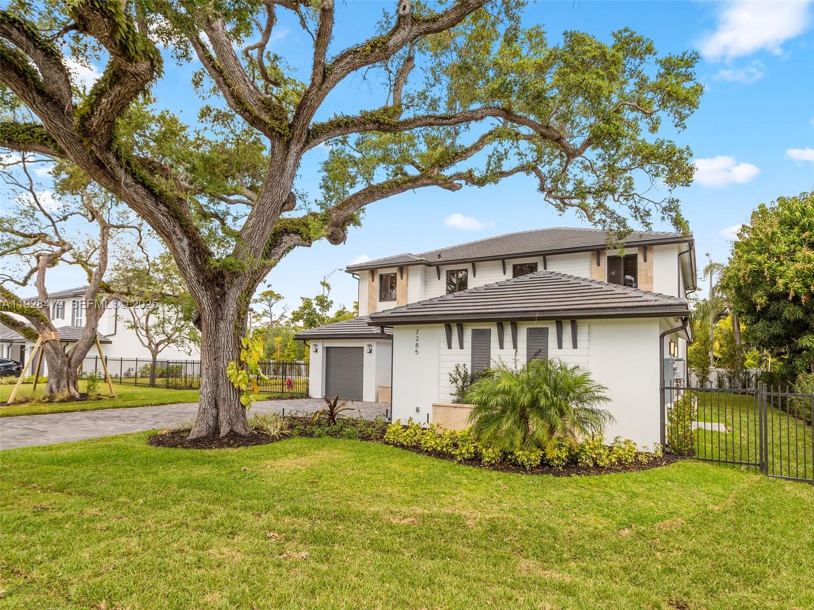 7285 Southwest 72nd Street Miami, FL 33143 - Photo 9 of 53 a view of a house with a yard