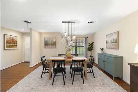 a living room with furniture and a rug