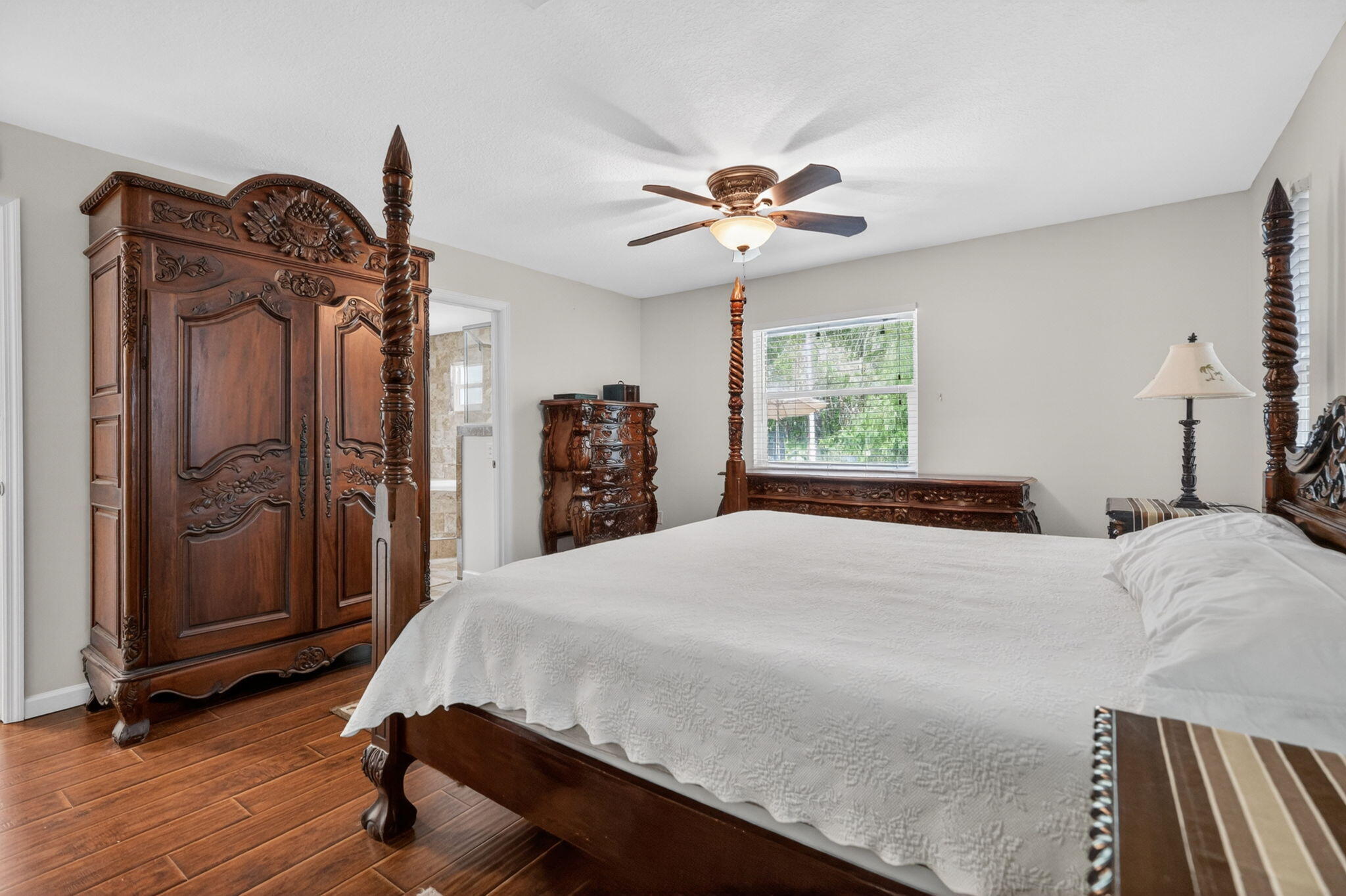 17391 Alexander Run Jupiter, FL 33478 - Photo 14 of 55 a bedroom with a bed dresser and a window
