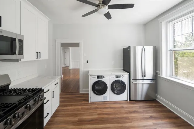 a kitchen with a stove and a refrigerator