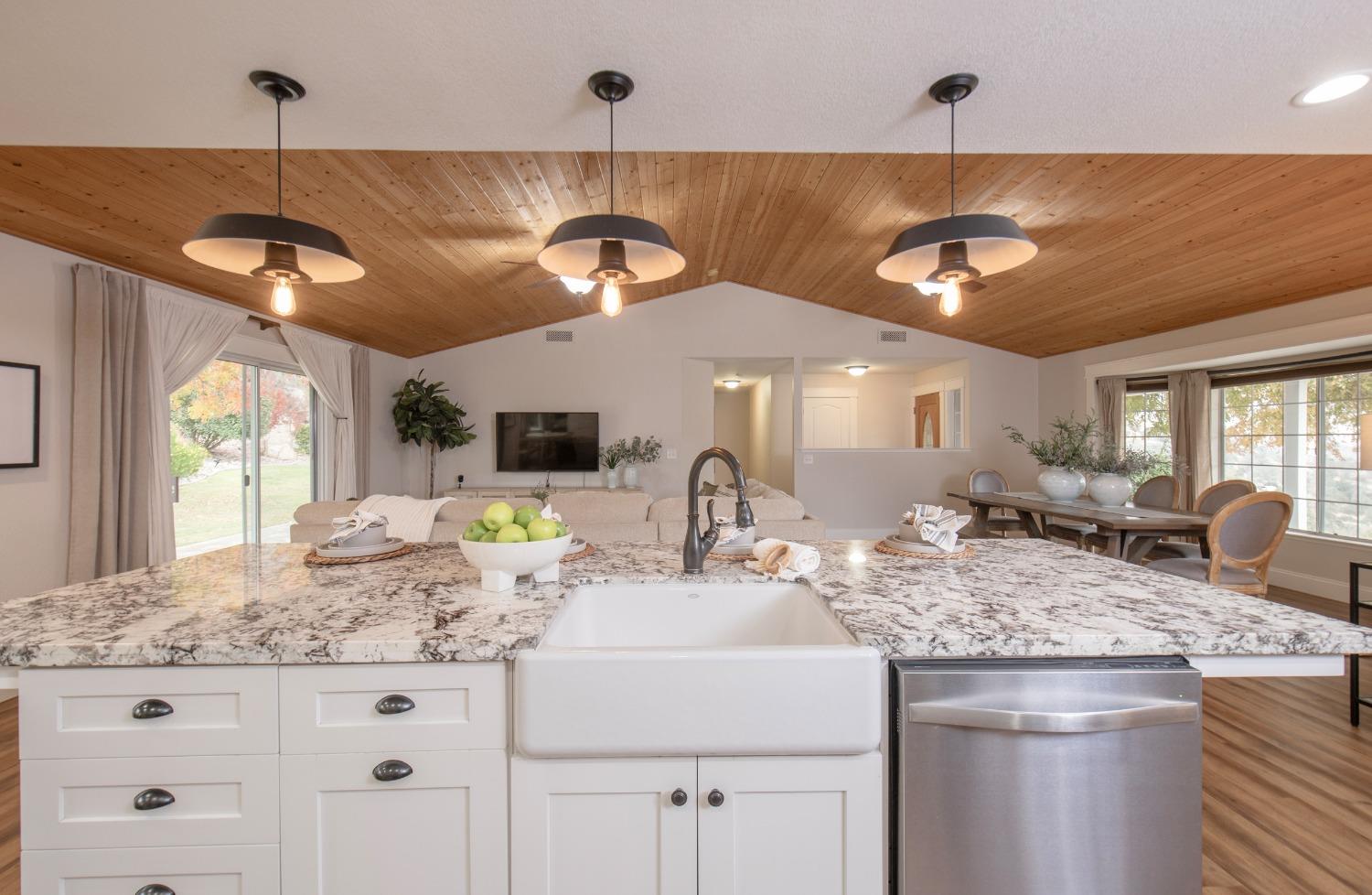 25390 White Thorne Road Clovis, CA 93619 - Photo 23 of 50 a kitchen with a sink a counter space and cabinets