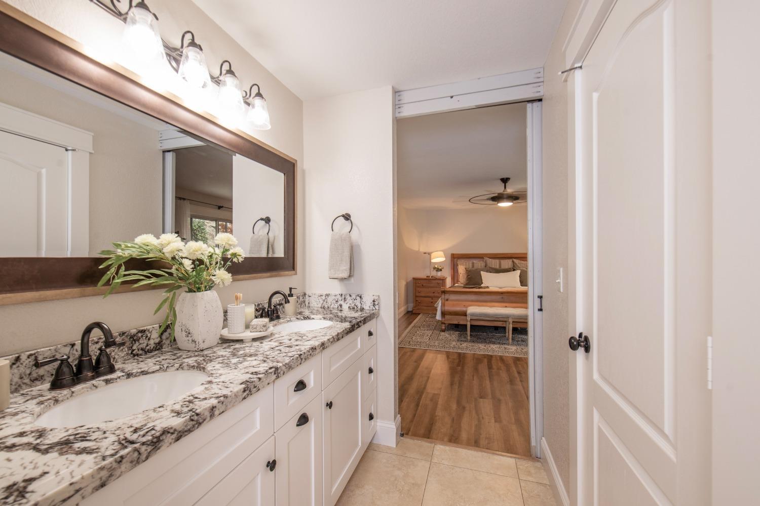 25390 White Thorne Road Clovis, CA 93619 - Photo 26 of 50 a bathroom with sinks double vanity and a mirror