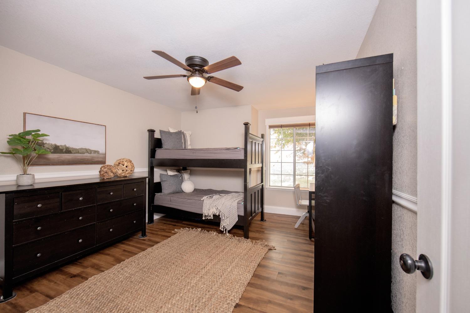 25390 White Thorne Road Clovis, CA 93619 - Photo 31 of 50 a bedroom with a bed and a dresser