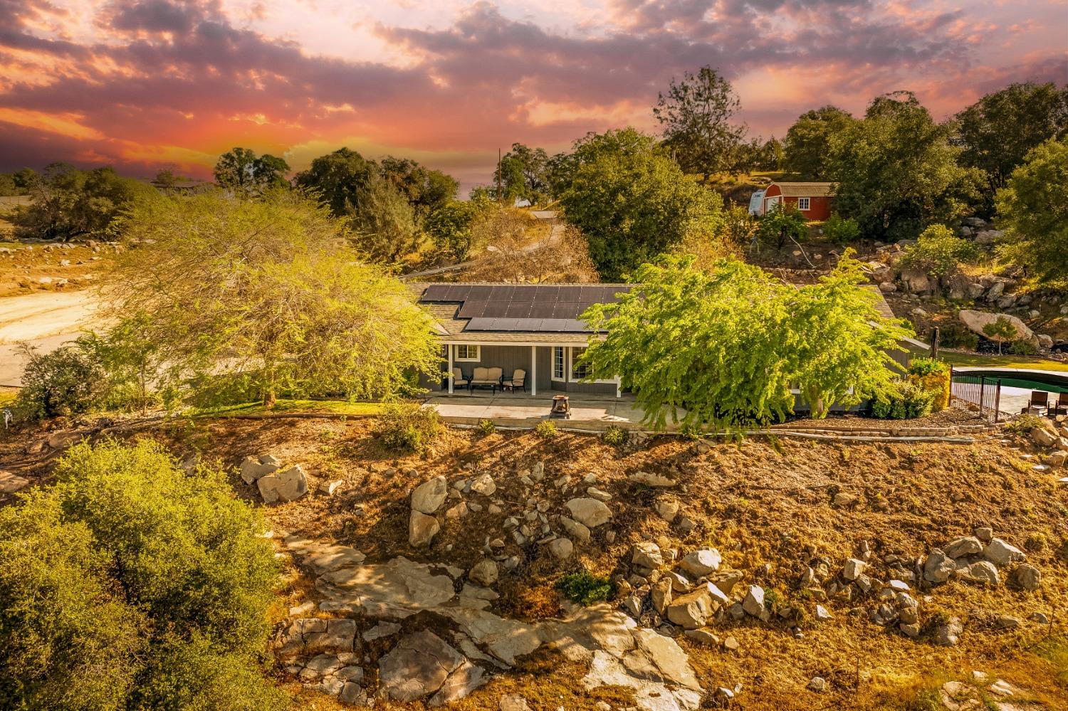 25390 White Thorne Road Clovis, CA 93619 - Photo 6 of 50 a view of a lake with a house in the background