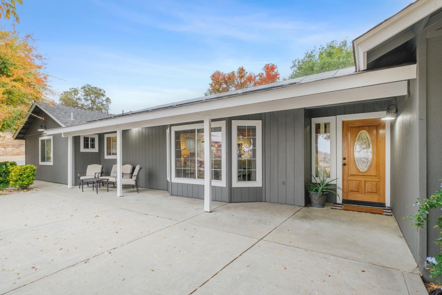 25390 White Thorne Road Clovis, CA 93619 - Photo 7 of 50 a view of house with patio outdoor seating space and porch