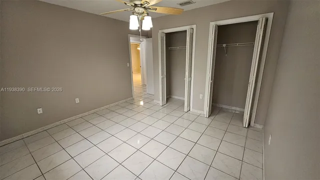 a view of an empty room and closet area