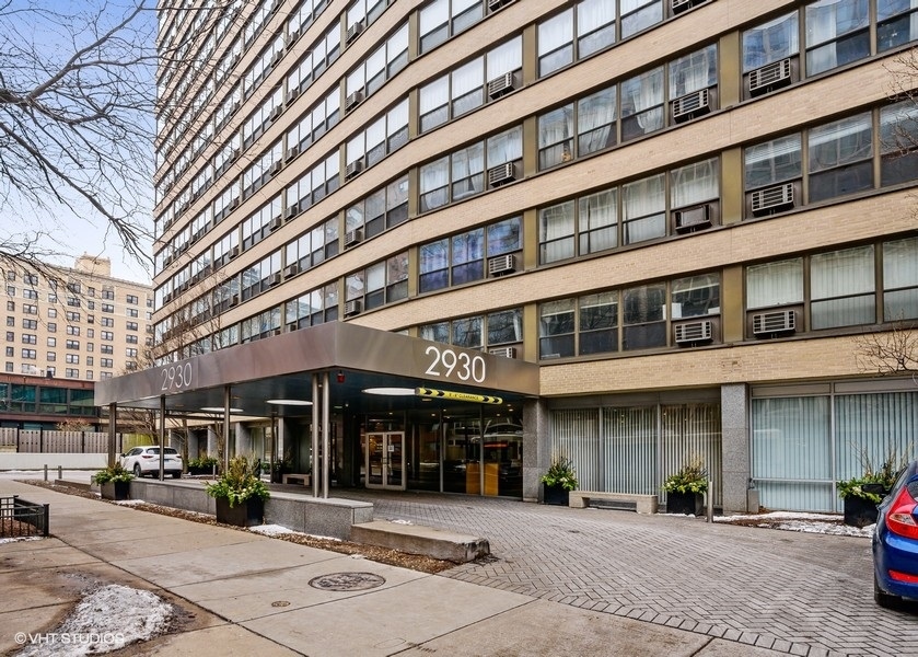 2930 North Sheridan Road, Unit 312 Chicago, IL 60657 - Photo 1 of 14 a front view of a building with street