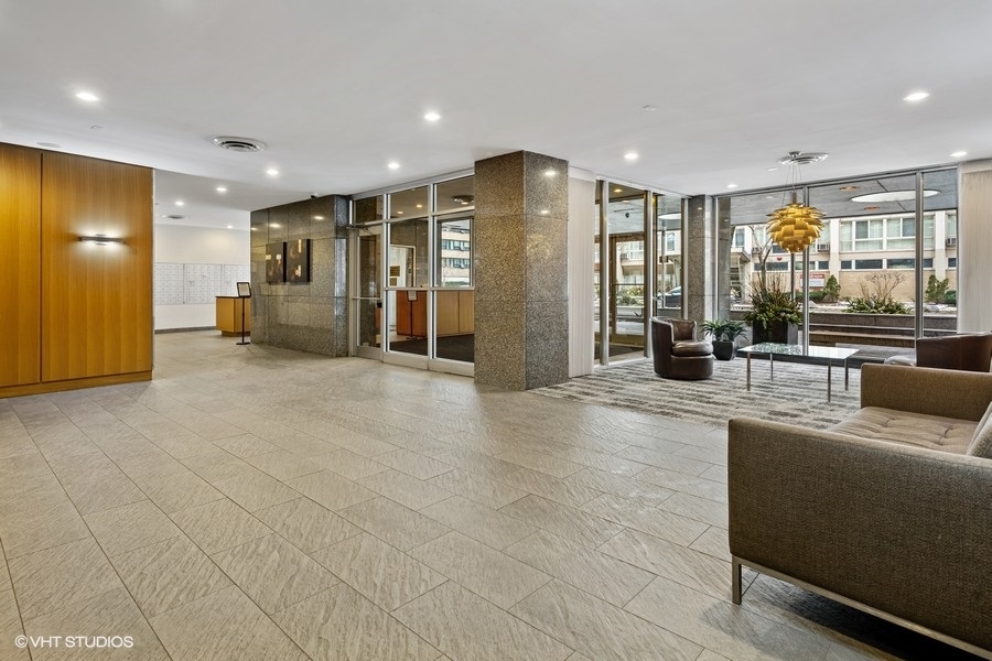 2930 North Sheridan Road, Unit 312 Chicago, IL 60657 - Photo 13 of 14 a view of a big room with large windows