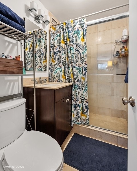 2930 North Sheridan Road, Unit 312 Chicago, IL 60657 - Photo 9 of 14 a bathroom with a toilet and shower