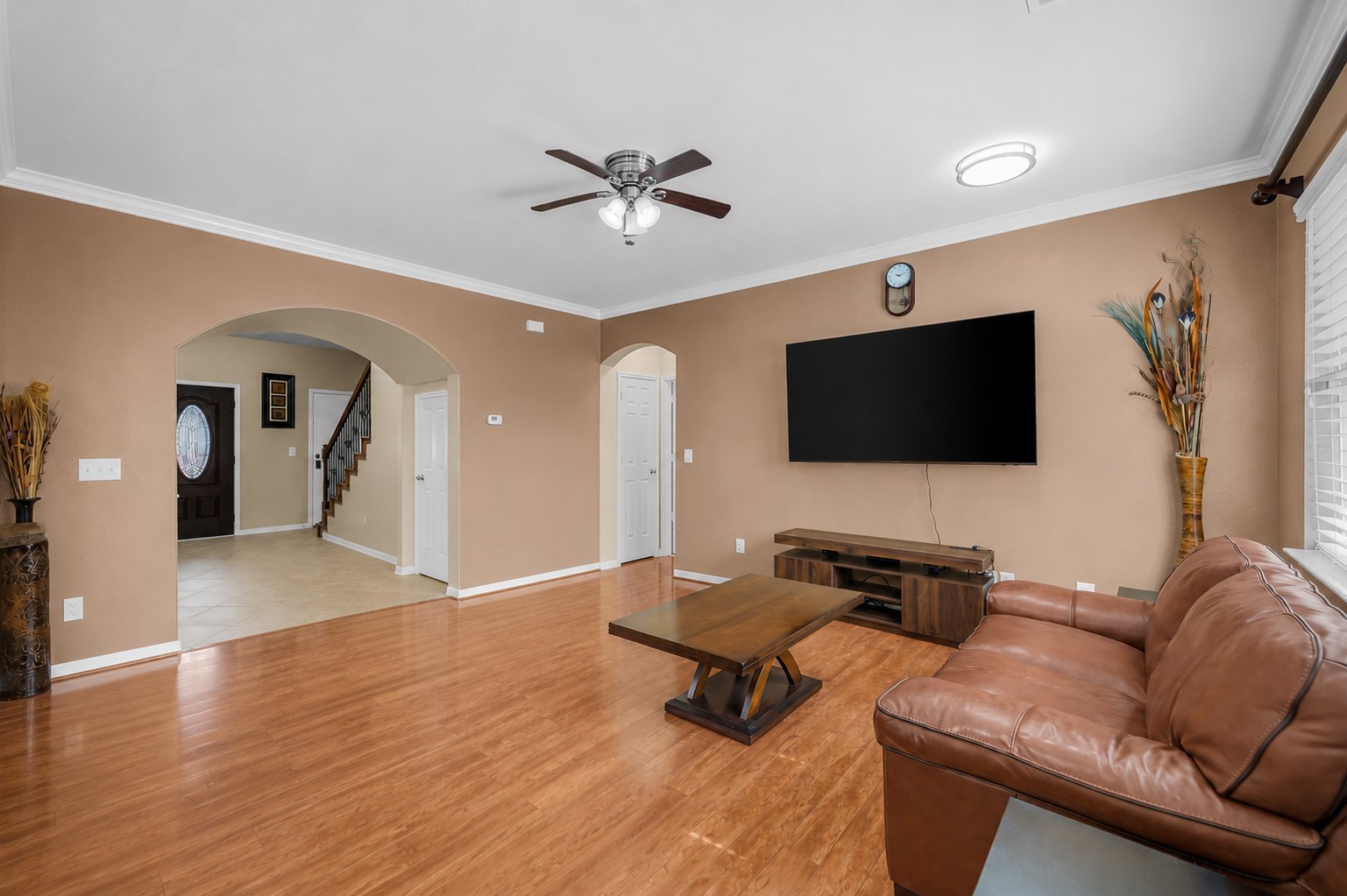 5406 Quarry Ridge Road Richmond, TX 77407 - Photo 9 of 36 Spacious family room with beautiful flooring, open sightlines to the foyer, and an inviting layout that brings everyone together for relaxing, entertaining, and everyday life.